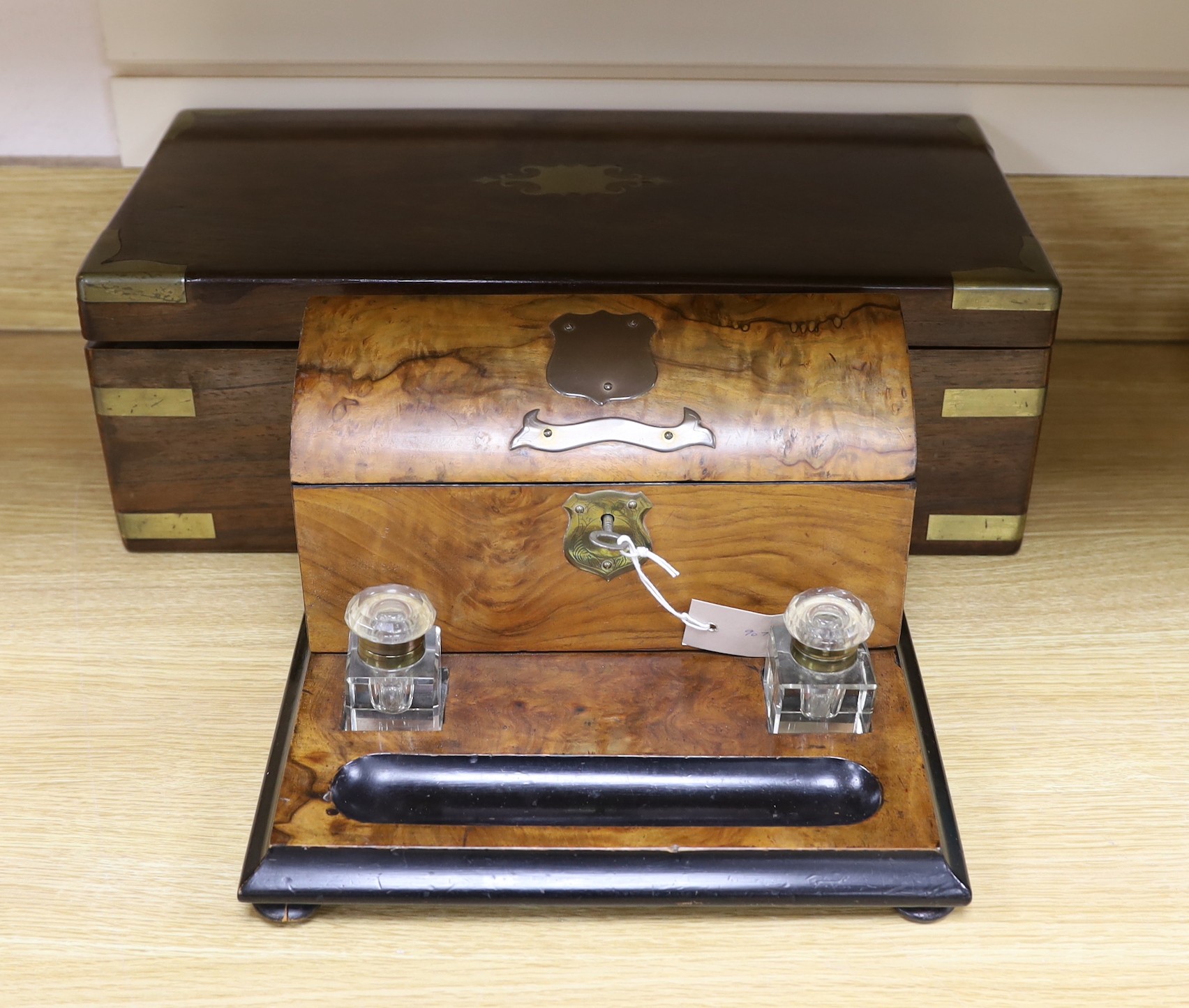A Victorian brass bound rosewood writing slope and a Victorian walnut inkstand stationery rack, largest 50cm wide